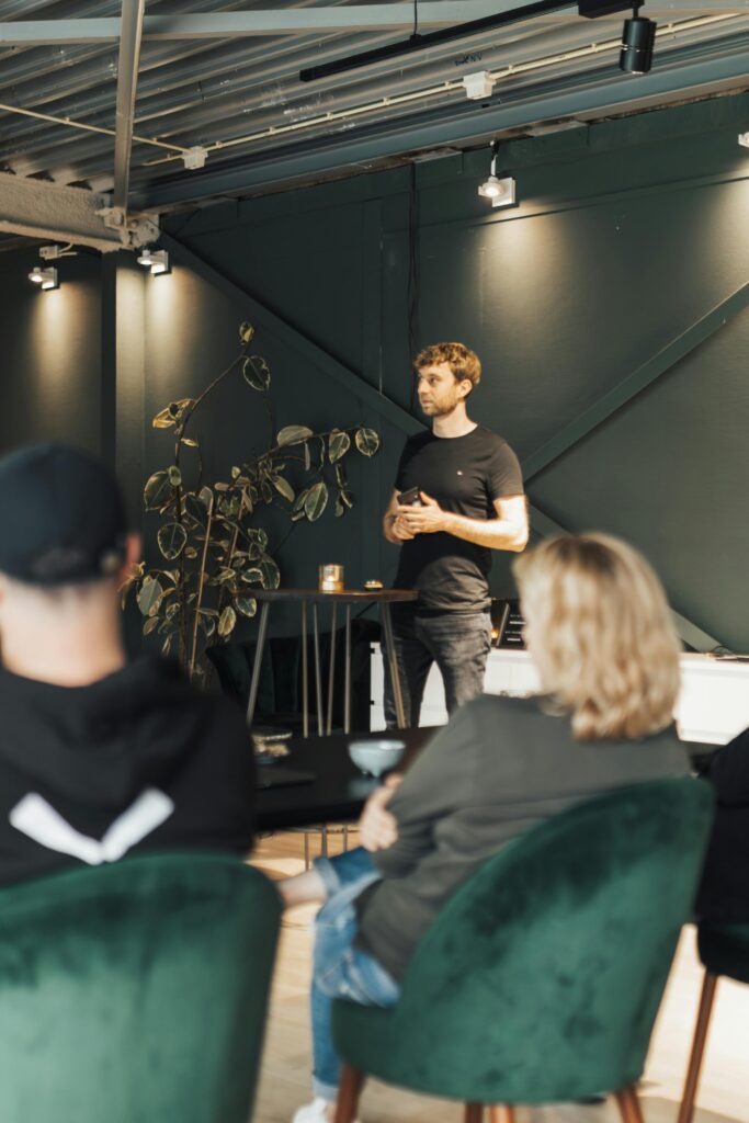 Business meeting with presenter in a contemporary office setting.